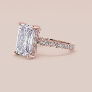 Rose gold 14K pear engagement ring with hidden halo accents and 3D pave design, perfect for a unique proposal or special occasion. 