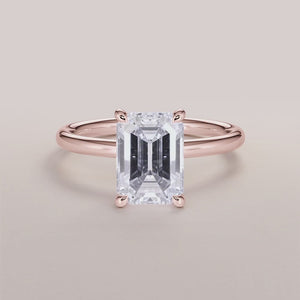 "Elegant 14K rose gold emerald classic solitaire engagement ring, featuring a stunning design that symbolizes timeless love.