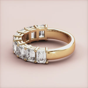 Elegant yellow gold half eternity wedding band featuring emerald-cut diamonds, available in 14K, 18K, or platinum settings. 