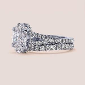 "Stylish 14K white gold oval split shank hidden halo engagement ring - elegant design perfect for modern brides.