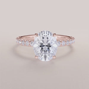 "Rose Gold 14K/18K Polaris Oval Wrapped Hidden Halo Engagement Ring with Pave Band, showcasing elegant prongs and accents.