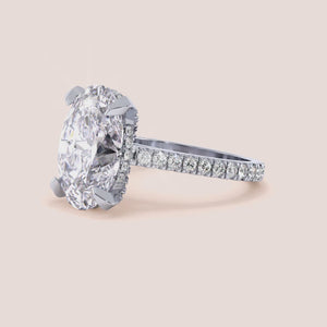 Radiant cut diamond engagement ring in 14K or 18K white gold or platinum with Pave diamond band, front view.