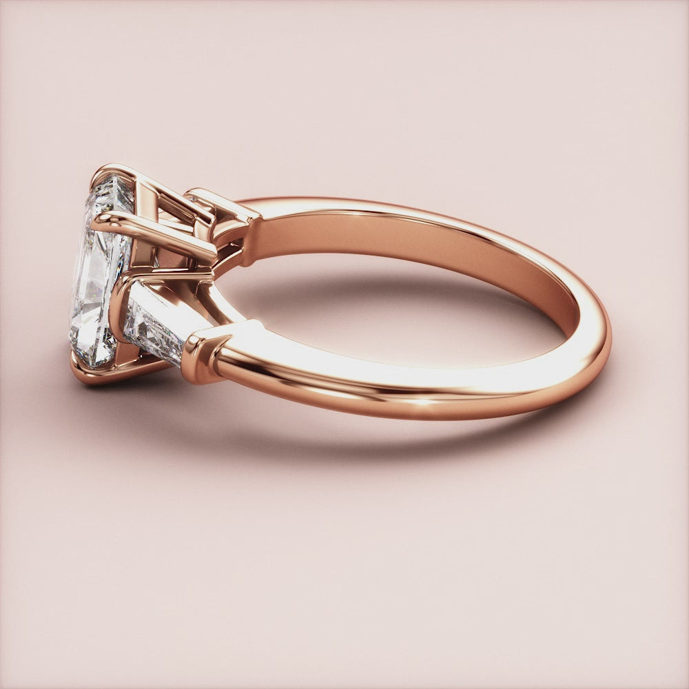 "Rose Gold 14K engagement ring featuring radiant three stone tapered baguettes, perfect for timeless elegance and romance.|







#14KRecycledRoseGold
#18KRecycledRoseGold


"
