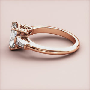"Rose Gold 14K engagement ring featuring radiant three stone tapered baguettes, perfect for timeless elegance and romance.