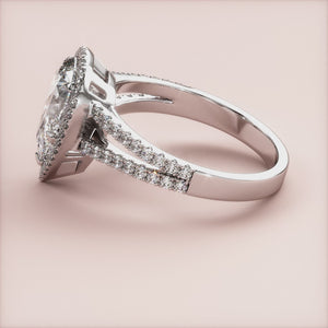 "14K white gold engagement ring featuring a pear halo, split shank cathedral pave band, perfect for a timeless proposal.