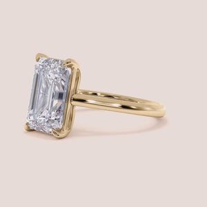 "14K Yellow Gold Emerald Solitaire Cathedral Engagement Ring, elegant design with stunning gemstone, perfect for romantic proposals.