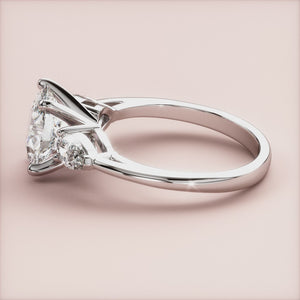 "Elegant 14K white gold Titania oval three-stone pear engagement ring, perfect for a timeless proposal.