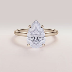 Modern Pear Diamond Engagement Ring in 14K Yellow Gold, featuring unique hexagon-shaped diamond and elegantPave band.