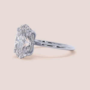 "Elegant 14K White Gold oval solitaire engagement ring with a plain shank and hidden halo, perfect for timeless love.