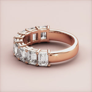 Elegant rose gold wedding band featuring emerald-cut diamonds, set in 14K or 18K gold.  Timeless half eternity design. 