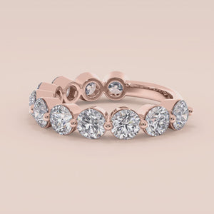 Rose gold wedding band featuring round brilliant-cut diamonds; available in 14K, 18K, or platinum settings. 