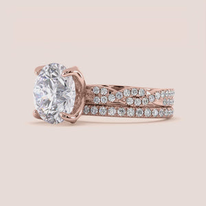 Rose gold teardrop halo engagement ring set featuring pear-shaped diamond, with options in 14K, 18K, or platinum settings.