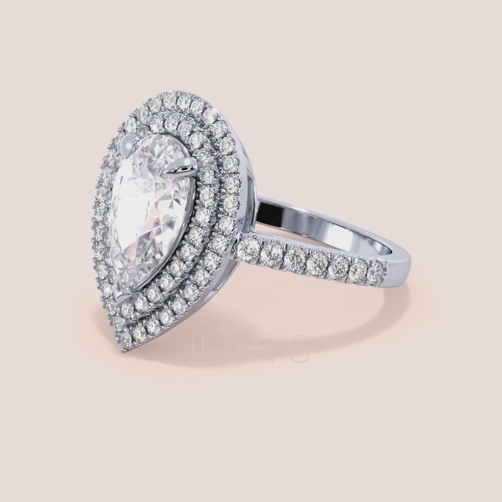 Pear shaped diamond engagement ring white gold with double halo and pavé band, side profile view, elevated hidden setting, luxury bridal ring | #14KRecycledWhiteGold #18KRecycledWhiteGold #Platinum