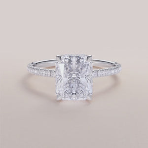 "Luxurious 14K or 18K white gold engagement ring with marquise-cut diamond and pave-set band, showcasing timeless elegance."