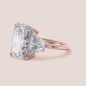 "Rose Gold 14K radiant three-stone trapezoid engagement ring, showcasing timeless elegance and brilliance. Perfect for proposals.