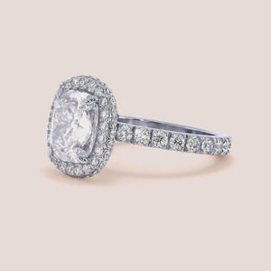 Radiant cut diamond engagement ring in 14K or 18K white gold or platinum with Pave diamond band, front view.