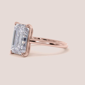"Rose Gold 14K Emerald Solitaire Cathedral Engagement Ring, Elegant Design for Timeless Romance and Unique Style.