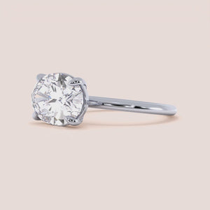 "Elegant 14K white gold oval east-west solitaire engagement ring, showcasing timeless beauty and sophistication.