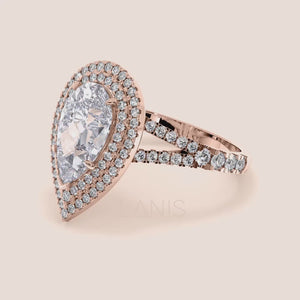 Charming rose gold engagement ring featuring a marquise diamond center stone encased in a sparkling double halo with a split shank pavé band. #14KRecycledRoseGold #18KRecycledRoseGold