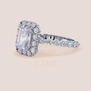 Detailed close-up video of radiant-cut halo diamond ring featuring a delicate diamond-accented band in white gold or platinum 