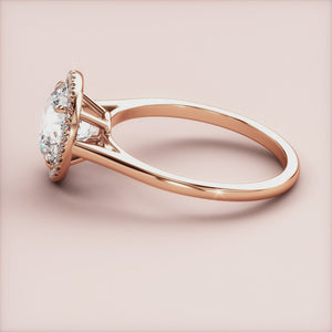 "Rose gold 14K and 18K engagement ring featuring a round halo and cathedral design, perfect for an elegant proposal.