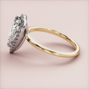 Radiant cut diamond engagement ring in 14K yellow gold with split-shank design and round diamond accents for a stunning look.