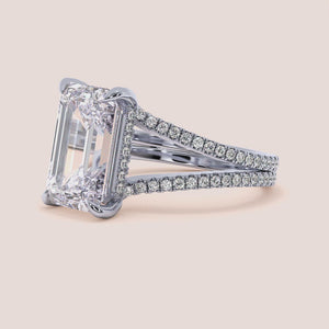 "Elegant 14K white gold emerald split shank engagement ring with hidden halo and invisible gallery, perfect for modern romance.