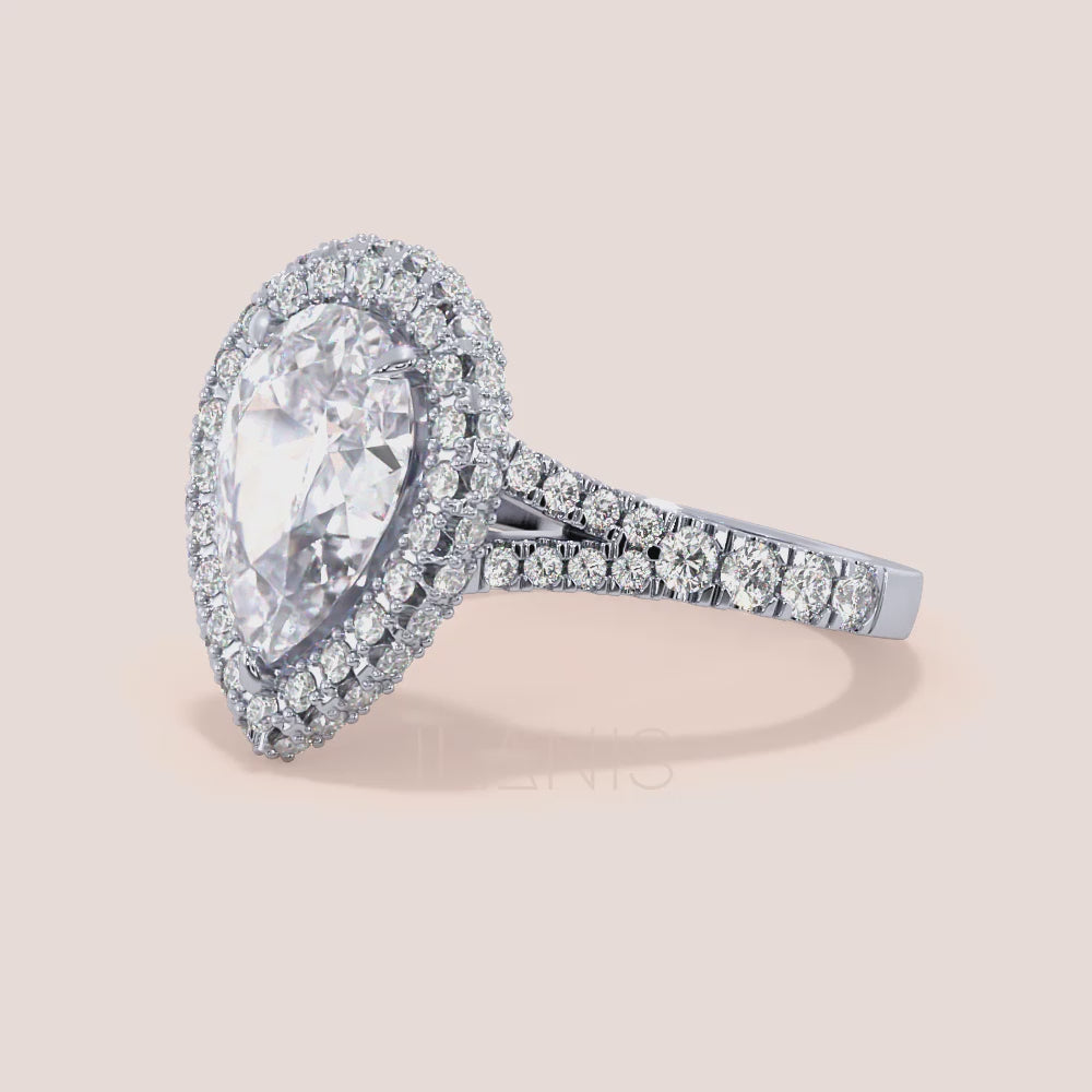 White gold pear diamond halo engagement ring with pavé band, intricate side view highlighting craftsmanship and brilliance | #14KRecycledWhiteGold #18KRecycledWhiteGold #Platinum