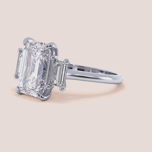 Radiant cut diamond engagement ring in 14K or 18K white gold or platinum with Pave diamond band, front view.