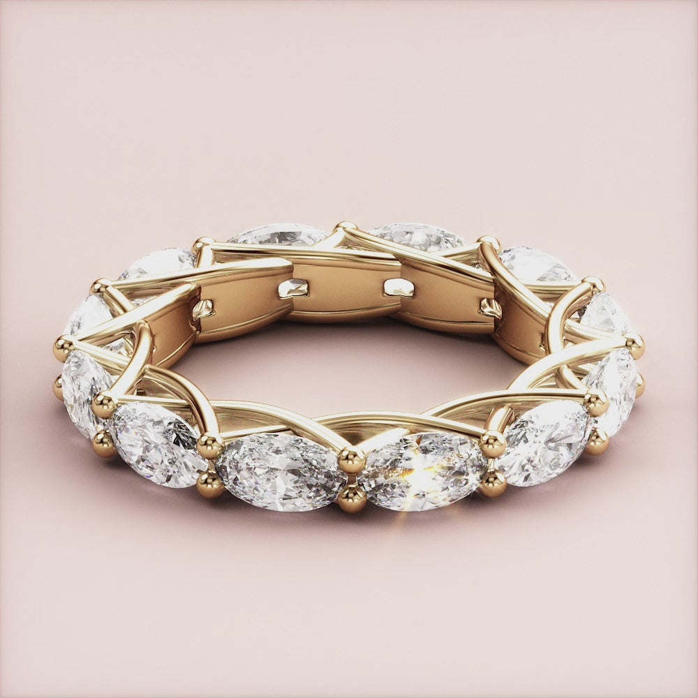 14K yellow gold eternity band ring featuring marquise-cut diamonds in an intricate lattice setting, not worn on model. |
 
 
 #14KRecycledYellowGold
 #18KRecycledYellowGold