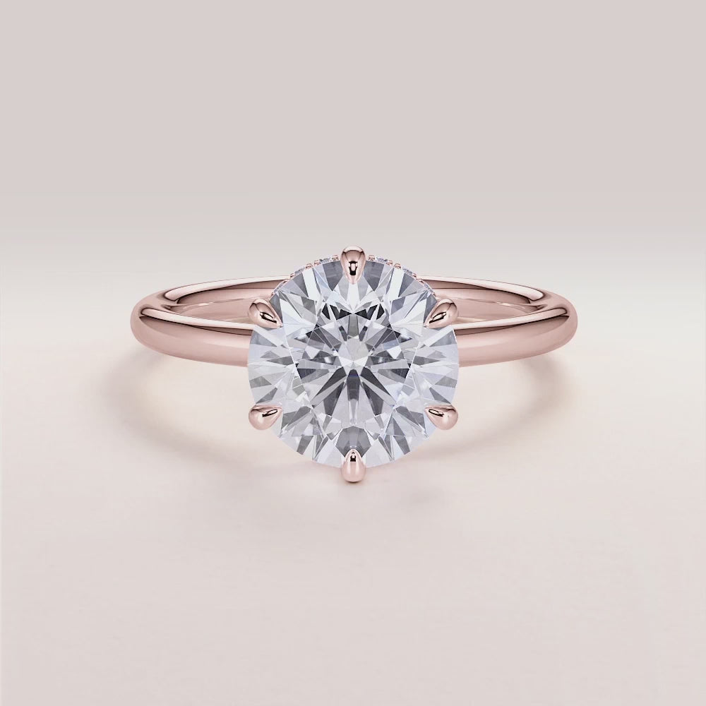 "Rose Gold 14K Vulcan round engagement ring with an invisible gallery, hidden halo, and plain band for modern elegance.|







#14KRecycledRoseGold
#18KRecycledRoseGold


"

