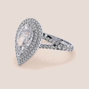 Elegant white gold engagement ring featuring a central cushion-cut diamond framed by a double row of micro-pave diamonds on the band, exuding sophistication. #14KRecycledWhiteGold #18KRecycledWhiteGold #Platinum