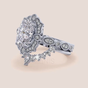 Detailed video viewing oval halo diamond ring set featuring intricate vintage filigree and accent diamonds in recycled rose gold 