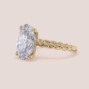 "14K Yellow Gold oval twisted plain band engagement ring, featuring a unique vine design for modern elegance.