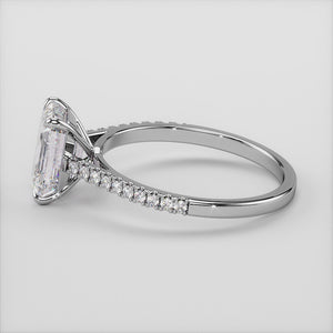 "Elegant 14K white gold emerald solitaire engagement ring with pave accents in a cathedral setting, perfect for timeless romance.