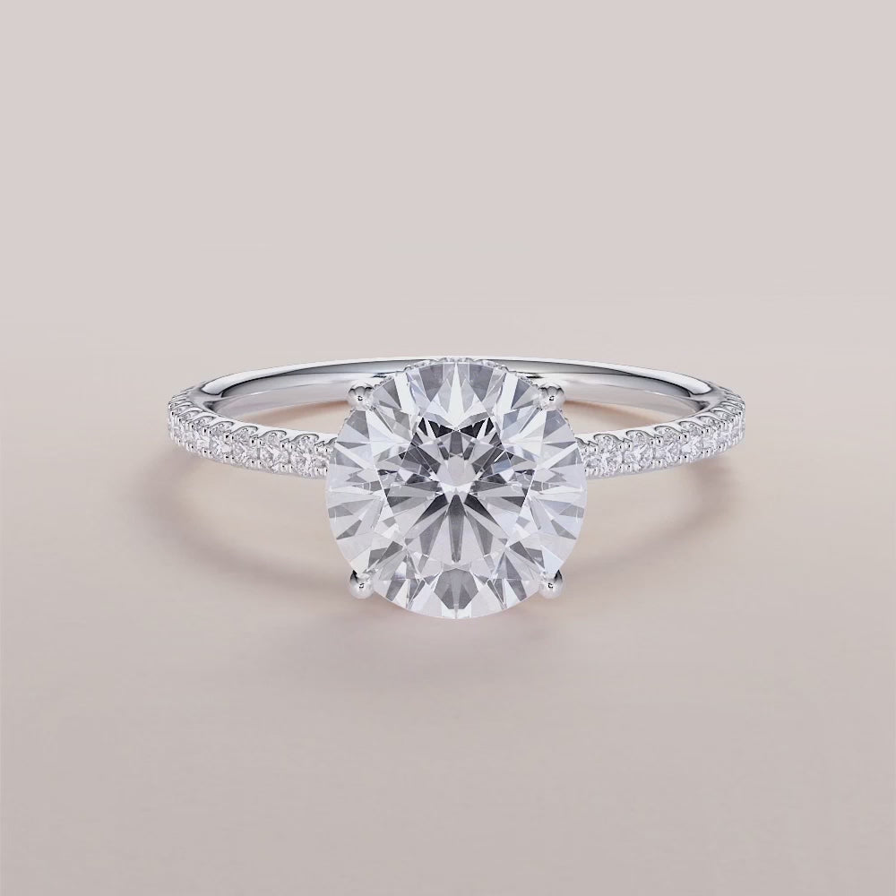 """Elegant 14K white gold Orion round wrapped hidden halo pave band engagement ring, perfect for timeless romance.""|

#14KRecycledWhiteGold
#18KRecycledWhiteGold








#Platinum"

