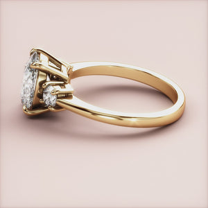 "18K yellow gold Vesta oval three stone round engagement ring with elegant design, perfect for timeless love.