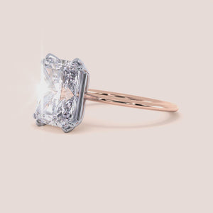 Video of Ava Minimalist Solitaire Radiant Cut Diamond Ring featuring a radiant cut diamond set in a two-tone band of either 14K/18K white and yellow gold or white and rose gold, designed for elegance and simplicity, ideal for engagements or special occasions. 