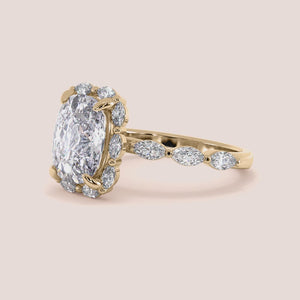 "Elegant yellow gold 14K cushion marquise halo engagement ring, featuring a stunning marquise band for timeless beauty.