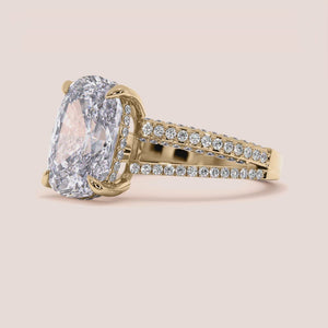 14K yellow gold Xena cushion hidden halo engagement ring with split shank and 3D pave detail, perfect for timeless elegance.