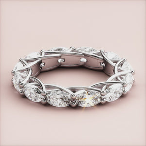 Luxurious 14K white gold eternity band with marquise-cut diamonds, showcasing impeccable craftsmanship and elegance for weddings. 