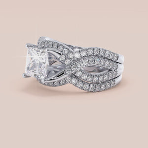 "14K white gold Myla ring set with princess-cut diamonds and twisted pave band, perfect for elegant engagements.