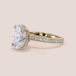 Oval diamond engagement ring in yellow gold, video showing side profile, hidden halo setting and pavé diamond band craftsmanship 