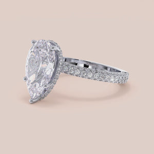 """14K white gold pear-shaped engagement ring with hidden halo accents and 3D pave design, perfect for romantic proposals.""