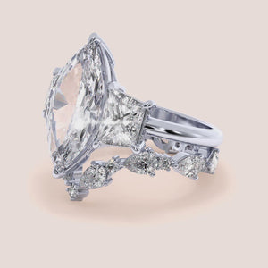 Elegant 14K or 18K gold or platinum engagement ring with a square diamond shape, worn on a model's hand, featuring accent diamonds.