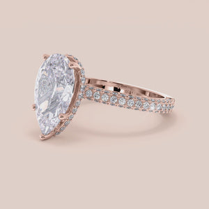 "Rose gold 14K pear engagement ring with hidden halo accents and 3D pave design, perfect for a unique proposal or special occasion.