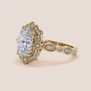 Detailed video of oval halo vintage-inspired diamond ring set with exquisite filigree in recycled rose gold 