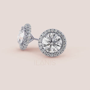White gold round halo diamond studs, back view featuring secure post and butterfly closure with fine jewelry finishing details 