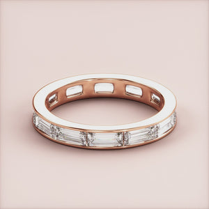Elegant baguette-cut diamond eternity band in 14K rose gold, perfect for weddings, displayed on a soft beige background. 