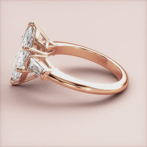 "Elegant 14K rose gold marquise three-stone tapered baguette engagement ring, perfect for timeless romance and sophistication.